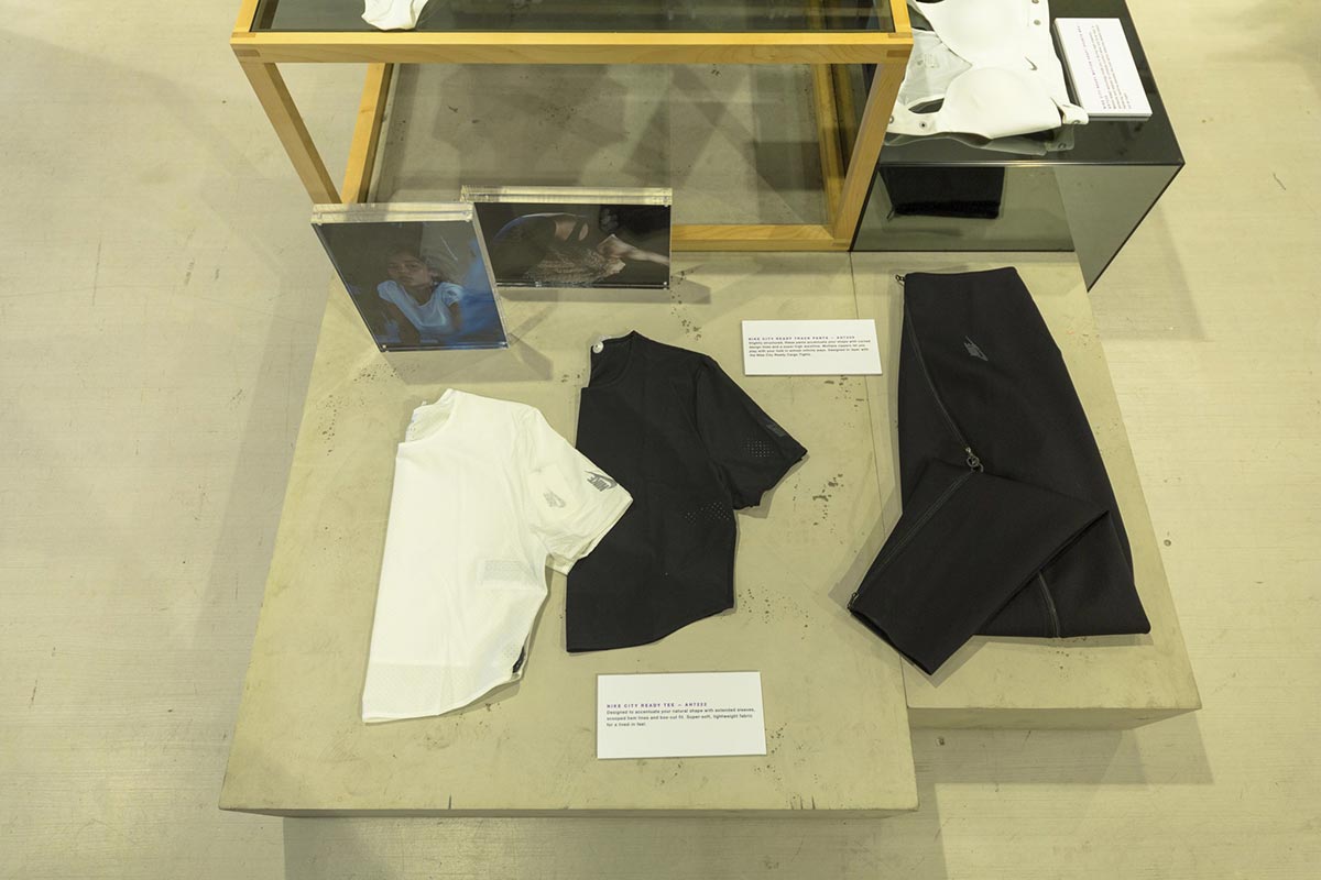 Nike City Ready retail installation - wooden display table with apparel flat lay