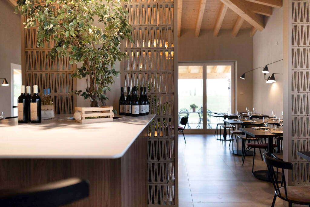 Custom wine tasting table stone top integrated planter restaurant design