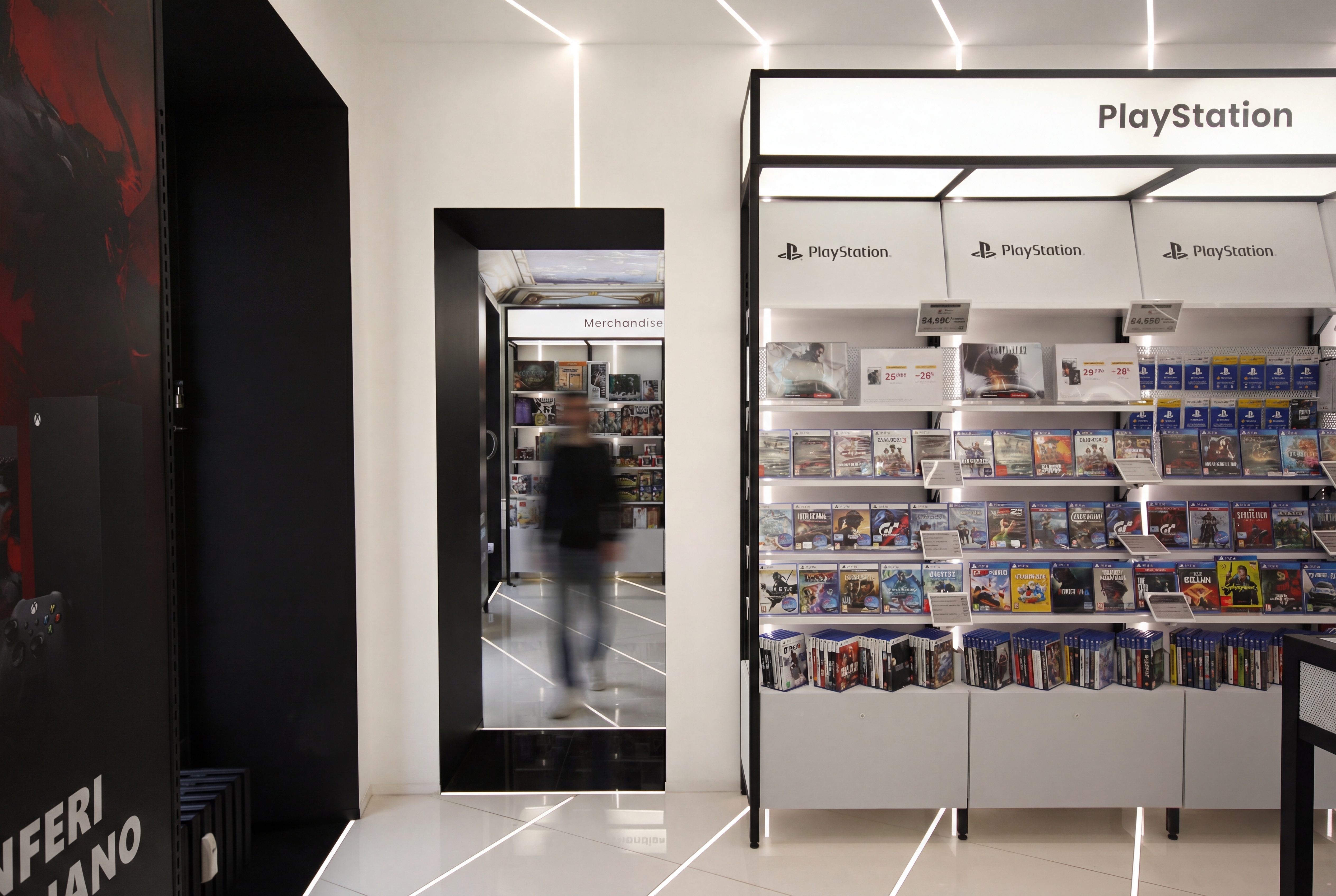 PlayStation section with shelving GameStop flagship Milan