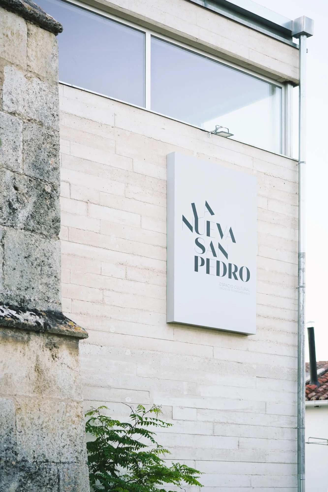 La Nueva San Pedro Espacio Cultural sign on the pale stone facade
