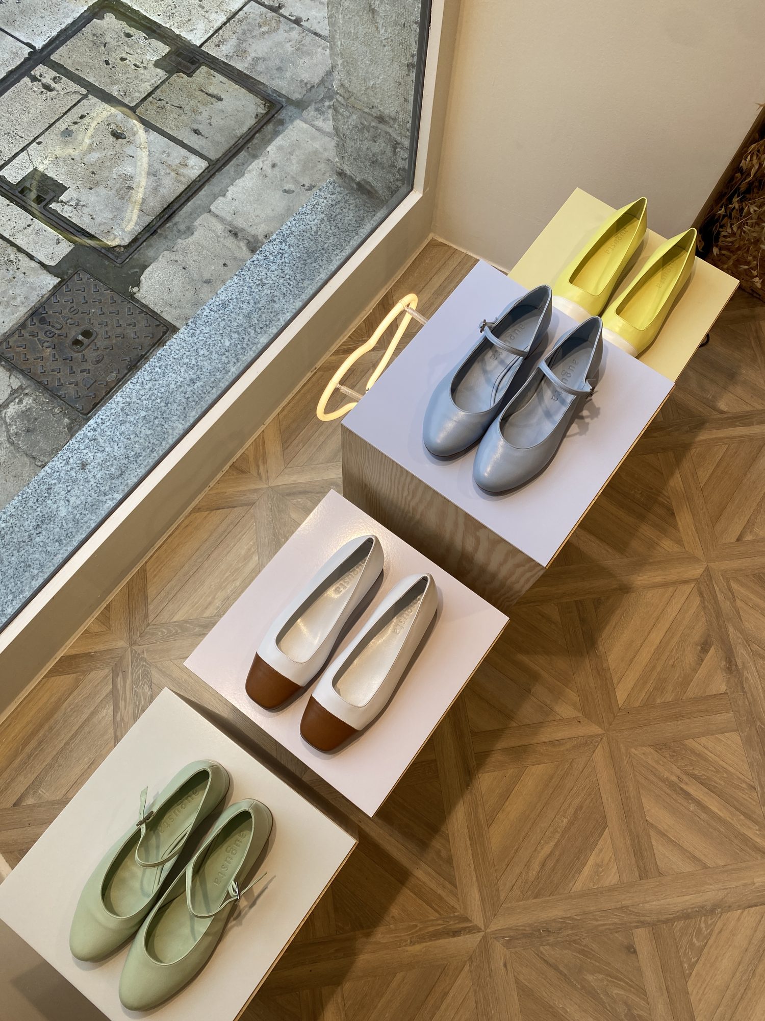 Top view of pine plinths with colourful Pocca ballet flats